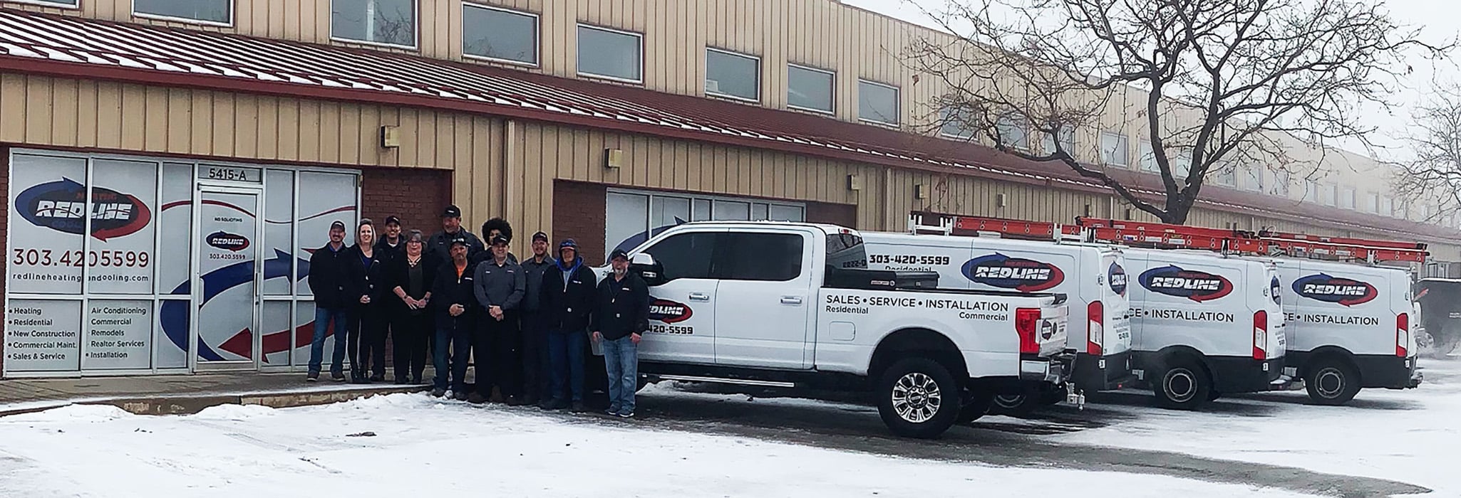 Redline Heating and Cooling Team members and trucks